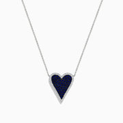 The Royale Bleu 14K White Gold Blue Sapphire and Diamond Heart Necklace features a heart-shaped pendant with blue sapphires and a diamond border, suspended on a fine chain against a white background.