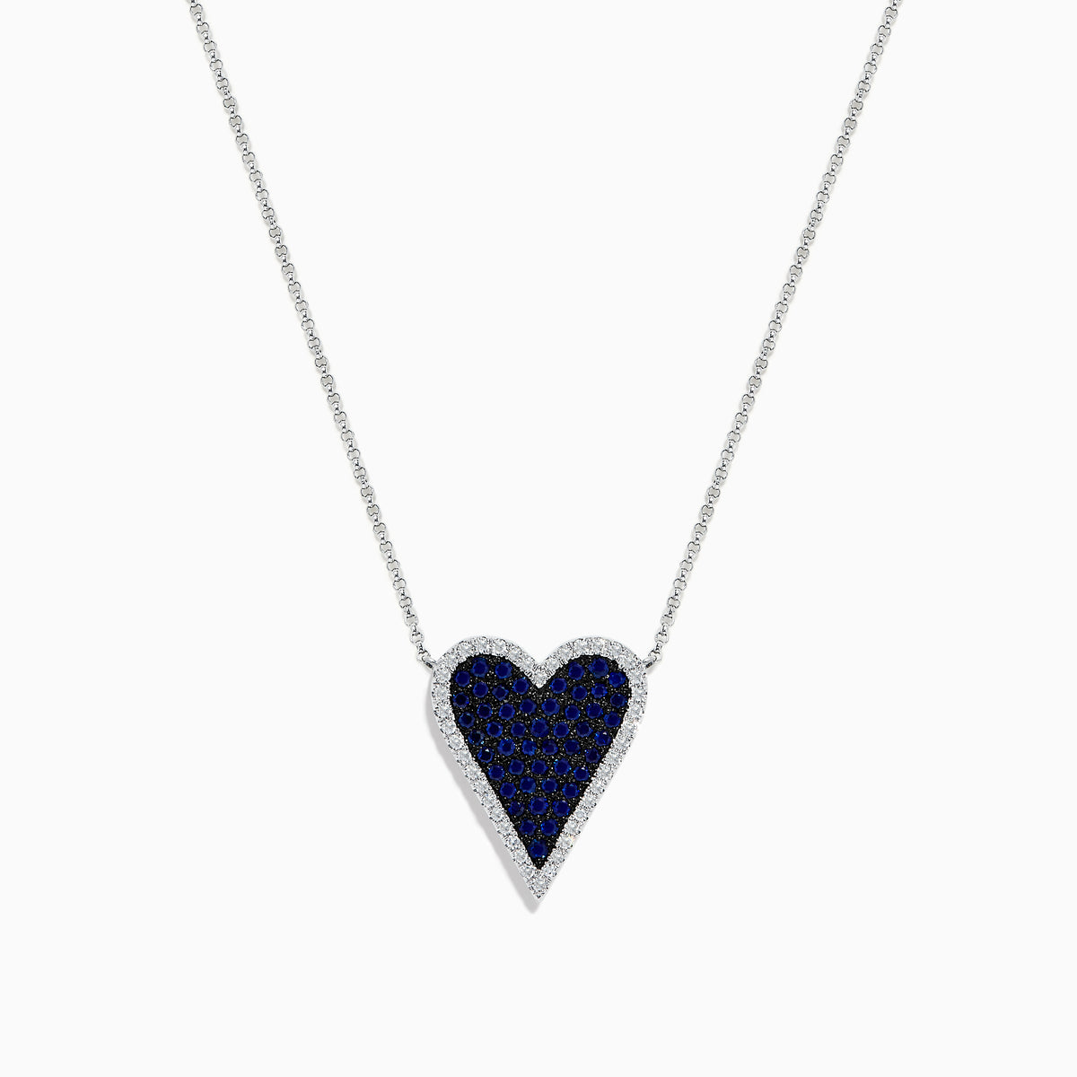 The Royale Bleu 14K White Gold Blue Sapphire and Diamond Heart Necklace features a heart-shaped pendant with blue sapphires and a diamond border, suspended on a fine chain against a white background.