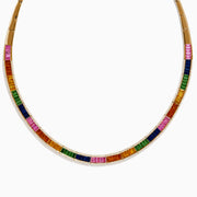 The Watercolors 14K Gold Multi Sapphire and Diamond Necklace features rectangular sapphires in vibrant orange, green, blue, pink, and yellow arranged symmetrically around a gold chain for a dazzling look.