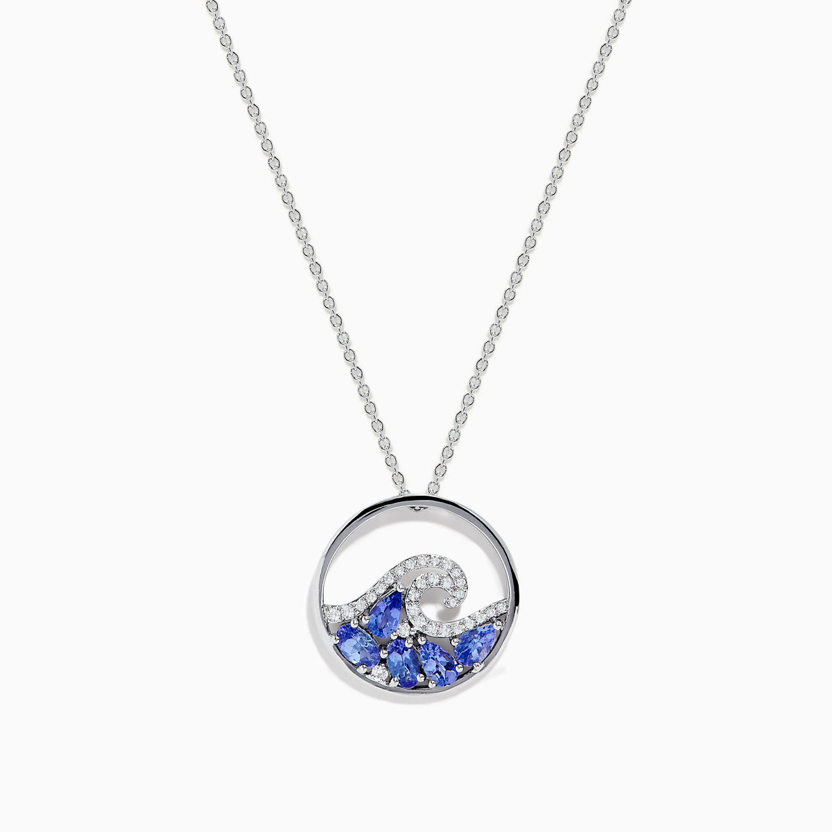The 925 Sterling Silver Tanzanite and Diamond Wave Pendant features a circular wave design with sparkling blue tanzanite and clear gemstones on a delicate chain, offering an elegant, ocean-inspired look.