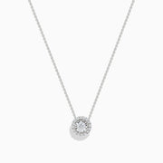 The Pave Classica 14K White Gold Diamond Pendant (0.49 TCW) by Effy features a brilliant round diamond surrounded by a halo of smaller diamonds, elegantly set on a simple white gold chain and showcased against a white background.