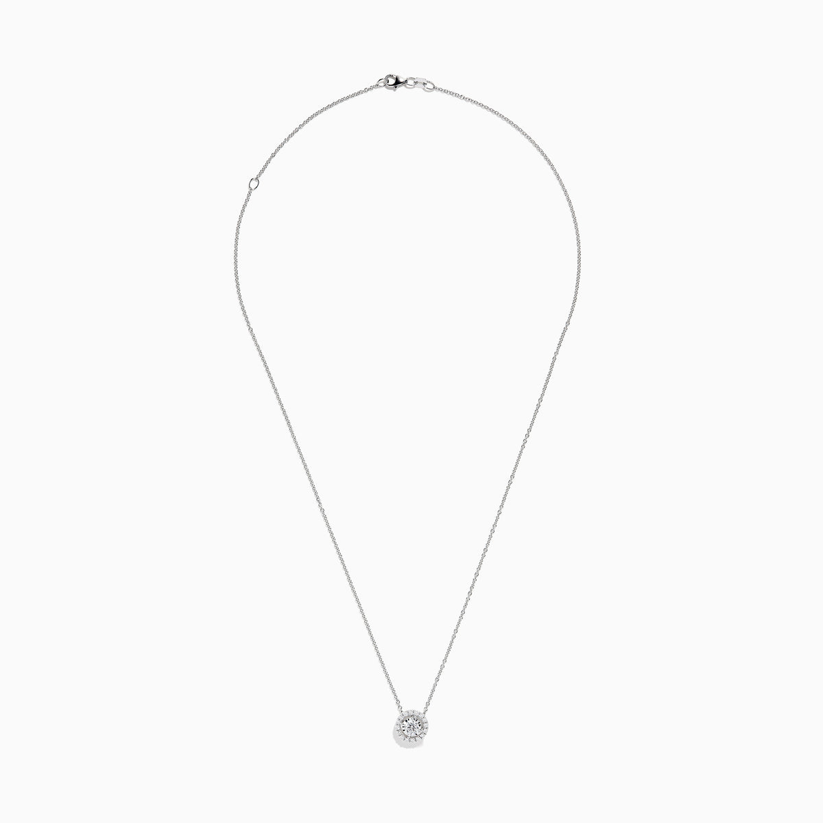 The Pave Classica 14K White Gold Diamond Pendant (0.49 TCW) by Effy features a brilliant round diamond surrounded by a halo of smaller diamonds, elegantly set on a simple white gold chain and showcased against a white background.