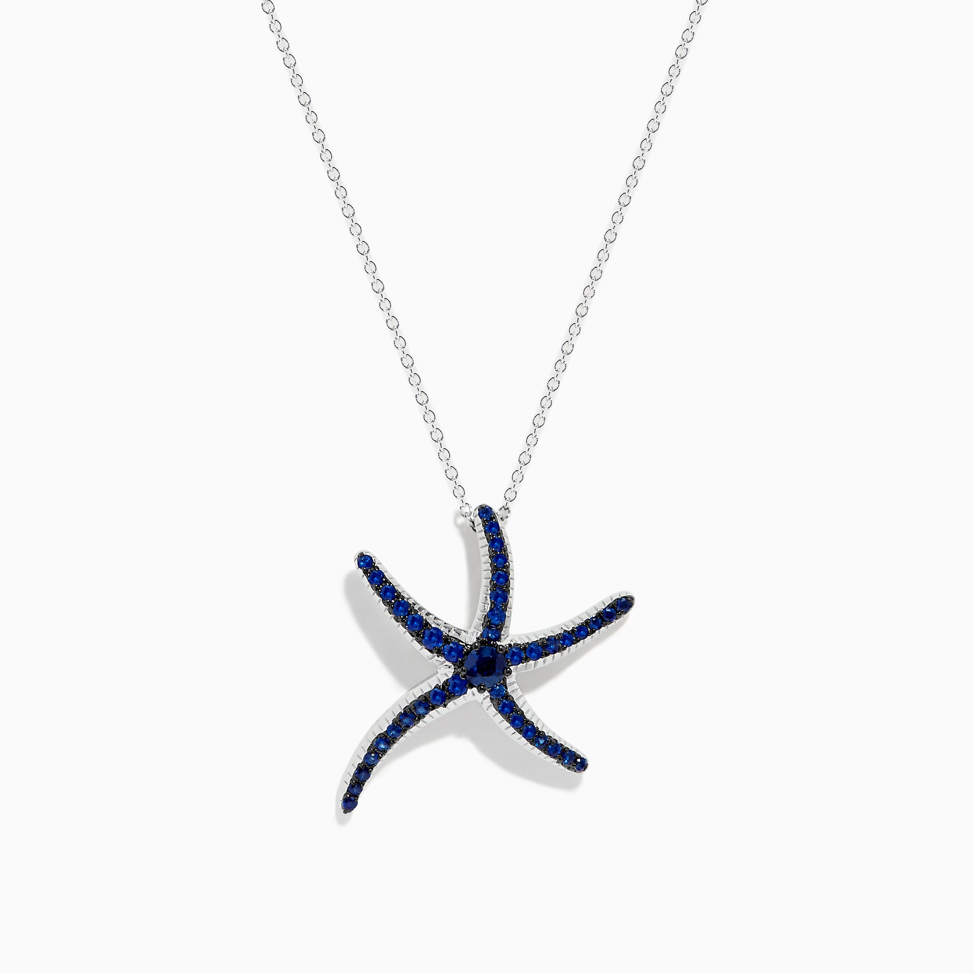 A Seaside 14K White Gold Sapphire Starfish Pendant, adorned with blue sapphires on each arm, is shown against a white background—an elegant piece from the Effy Seaside collection.