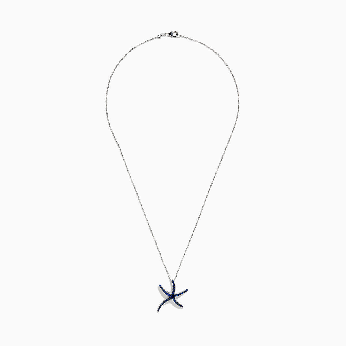 A Seaside 14K White Gold Sapphire Starfish Pendant, adorned with blue sapphires on each arm, is shown against a white background—an elegant piece from the Effy Seaside collection.