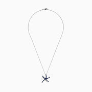 A Seaside 14K White Gold Sapphire Starfish Pendant, adorned with blue sapphires on each arm, is shown against a white background—an elegant piece from the Effy Seaside collection.