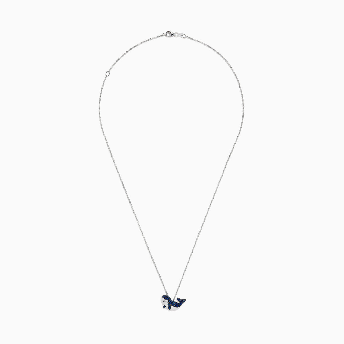 A 14K white gold necklace featuring a whale-shaped pendant adorned with sapphires and diamonds, suspended on a delicate chain.