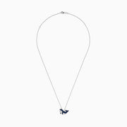 A 14K white gold necklace featuring a whale-shaped pendant adorned with sapphires and diamonds, suspended on a delicate chain.