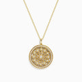 The DOro 14K Yellow Gold Diamond Mandala Pendant features a circular design with an intricate, symmetrical floral pattern set with sparkling white diamonds.