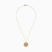 The DOro 14K Yellow Gold Diamond Mandala Pendant features a circular design with an intricate, symmetrical floral pattern set with sparkling white diamonds.