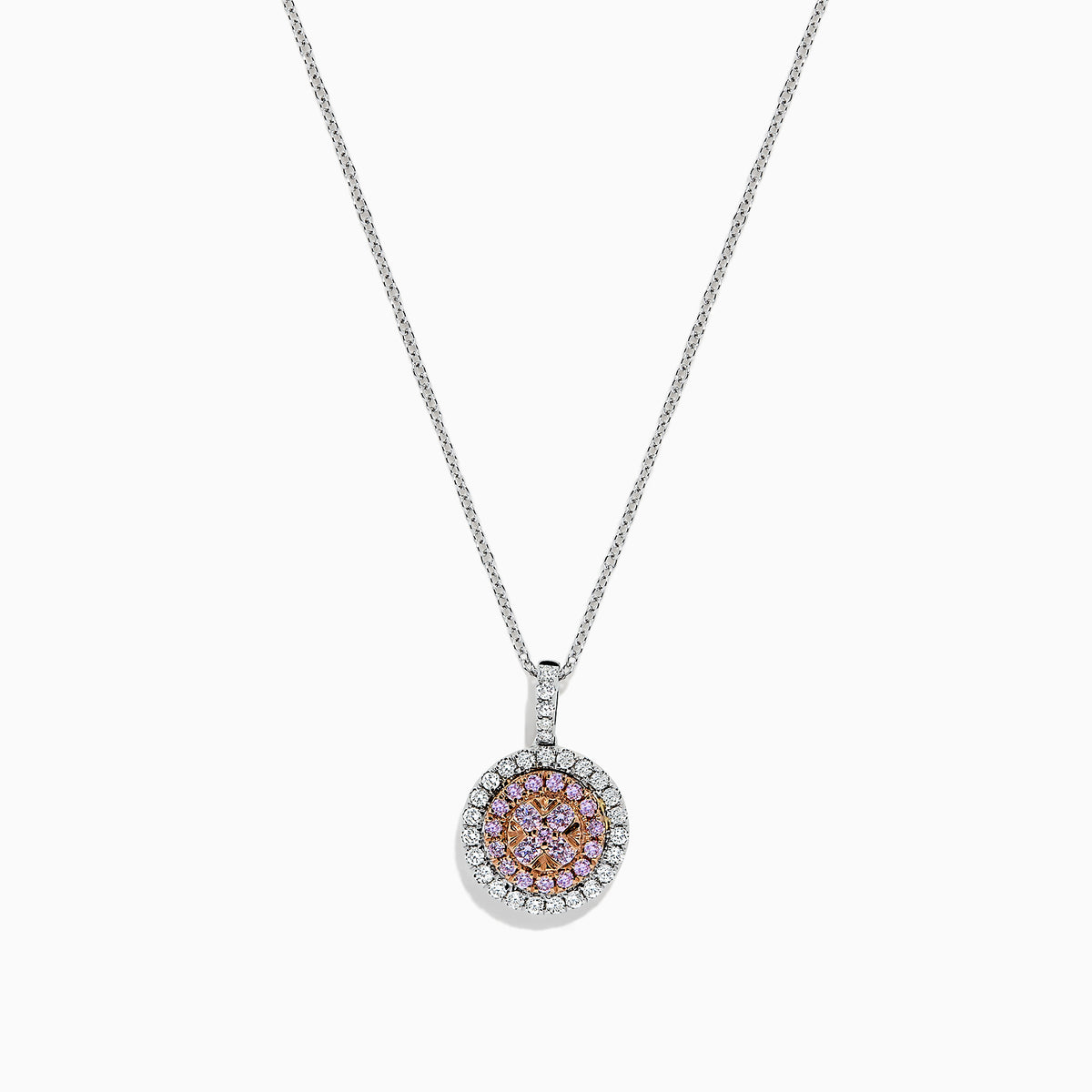 The 14K Two Tone Gold Pink and White Diamond Pendant (0.54 TCW) combines pink center stones with a double halo of sparkling diamonds for an elegant, eye-catching look reminiscent of a classic diamond pendant.