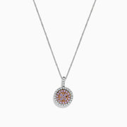 The 14K Two Tone Gold Pink and White Diamond Pendant (0.54 TCW) combines pink center stones with a double halo of sparkling diamonds for an elegant, eye-catching look reminiscent of a classic diamond pendant.
