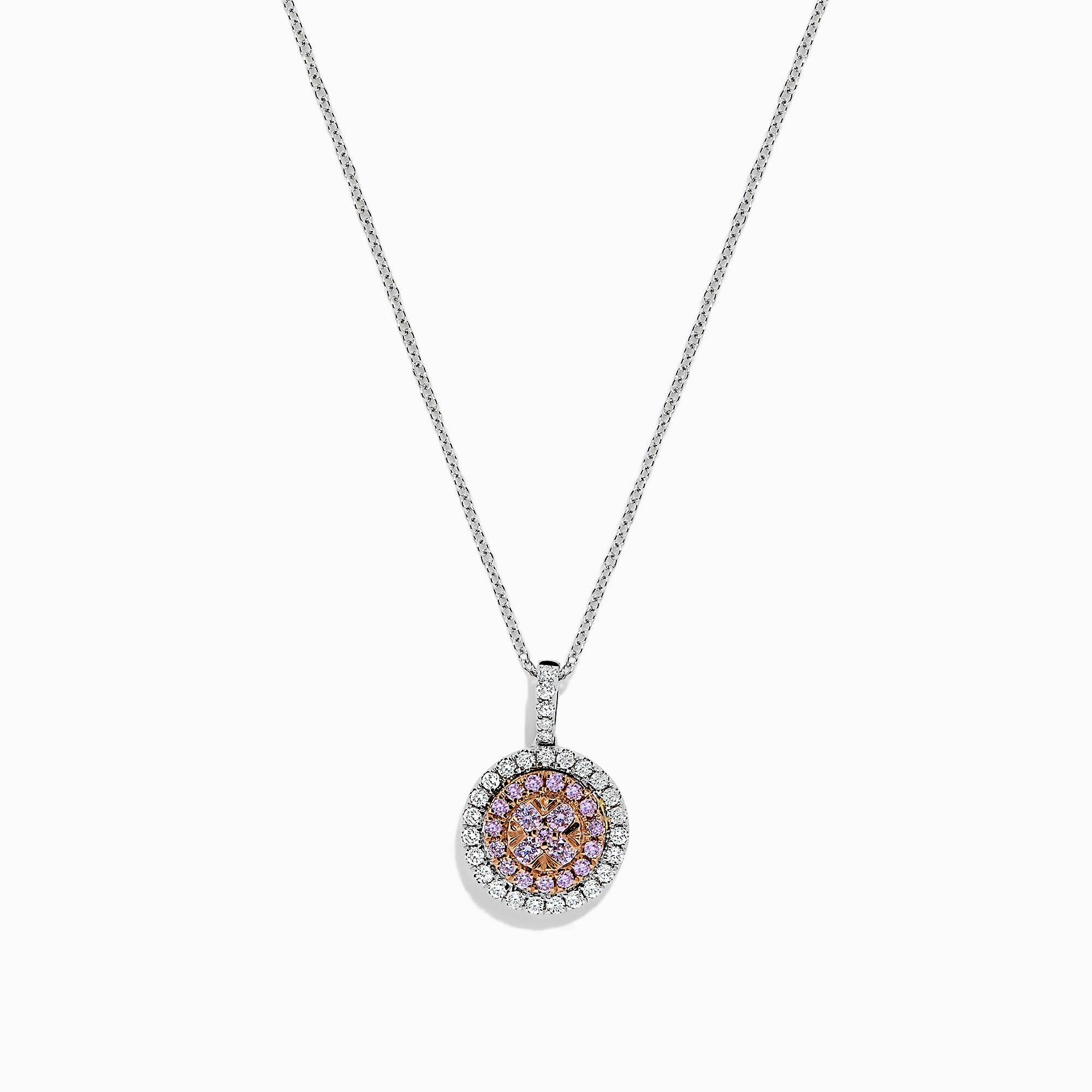 The 14K Two Tone Gold Pink and White Diamond Pendant (0.54 TCW) combines pink center stones with a double halo of sparkling diamonds for an elegant, eye-catching look reminiscent of a classic diamond pendant.