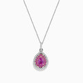 The 14K Two Tone Gold Pink Sapphire and Diamond Pendant, 1.74 TCW, features a pear-shaped pink sapphire surrounded by clear and yellow stones in a halo design, blending diamond-like elegance with stylish two-tone gold accents.