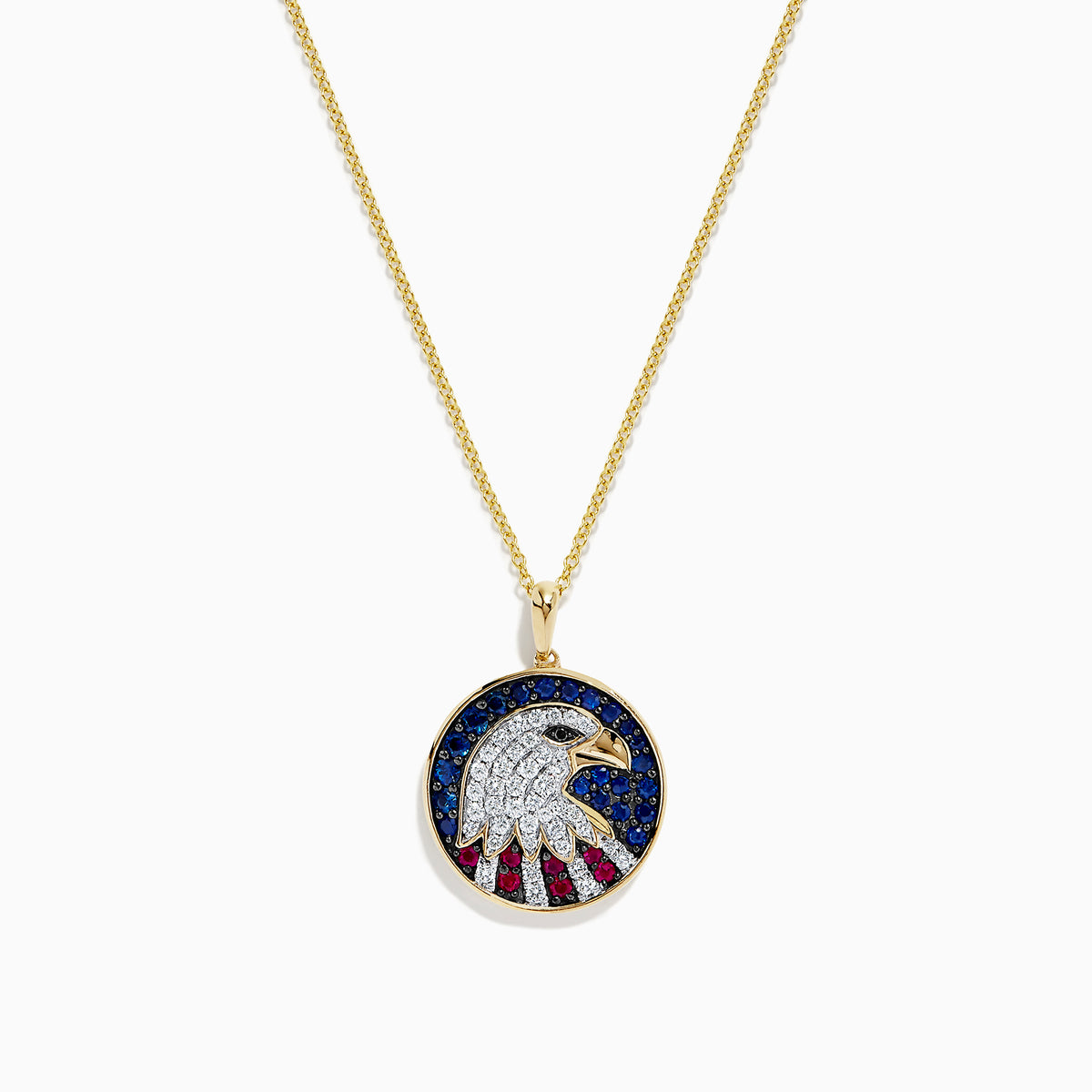 The Novelty 14K Gold Ruby, Sapphire & Diamond Eagle Head Pendant (1.06 TCW) features a round pendant with a stylized eagle head and patriotic background, embellished with ruby, sapphire, and diamond stones.