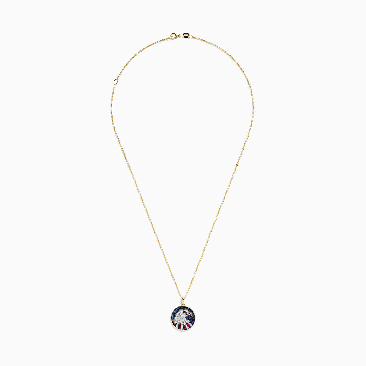 The Novelty 14K Gold Ruby, Sapphire & Diamond Eagle Head Pendant (1.06 TCW) features a round pendant with a stylized eagle head and patriotic background, embellished with ruby, sapphire, and diamond stones.