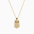 The Safari 14K Yellow Gold Black and White Diamond Owl Pendant features clear stones with black and white diamond eyes, all on a delicate gold chain.