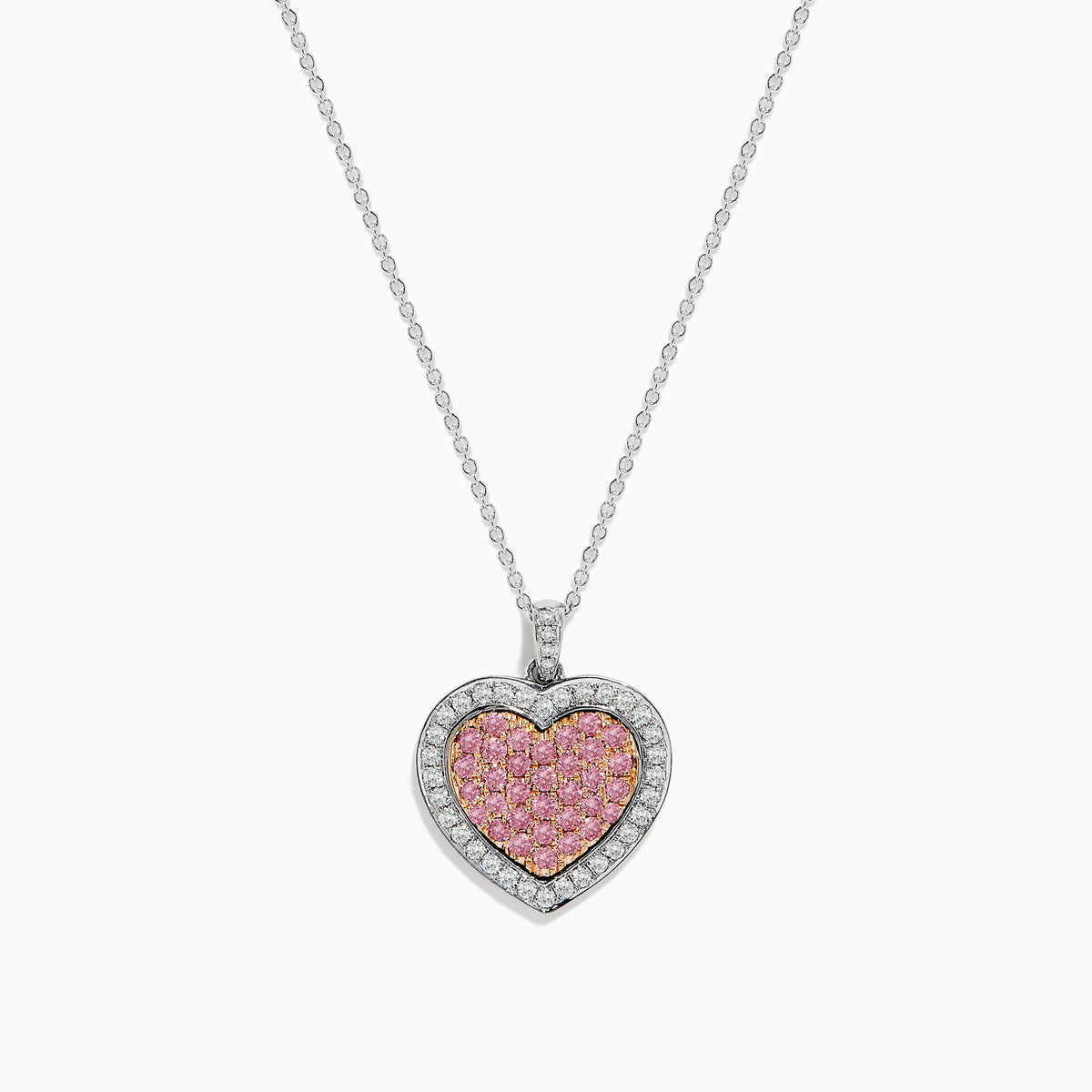 The 18K Two-Tone Gold White and Pink Diamond Heart Pendant features pink diamonds at the center, accented by a border of sparkling white diamonds for a stunning look.