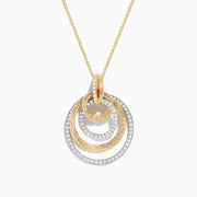 The Duo 14K Two-Tone Gold Diamond Crossover Pendant features three interlocking textured gold rings and a smooth diamond-encrusted silver ring on a gold chain, creating an elegant layered look.
