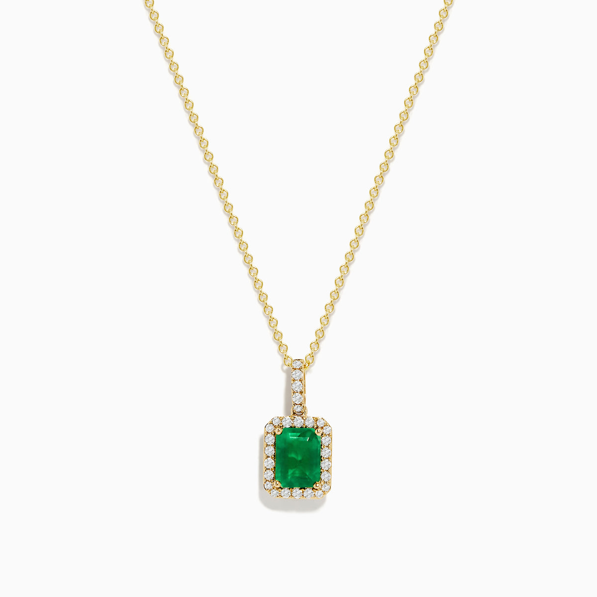 The 14K Yellow Gold Diamond and Emerald Pendant showcases a rectangular green emerald set in yellow gold, accented by small clear diamonds.