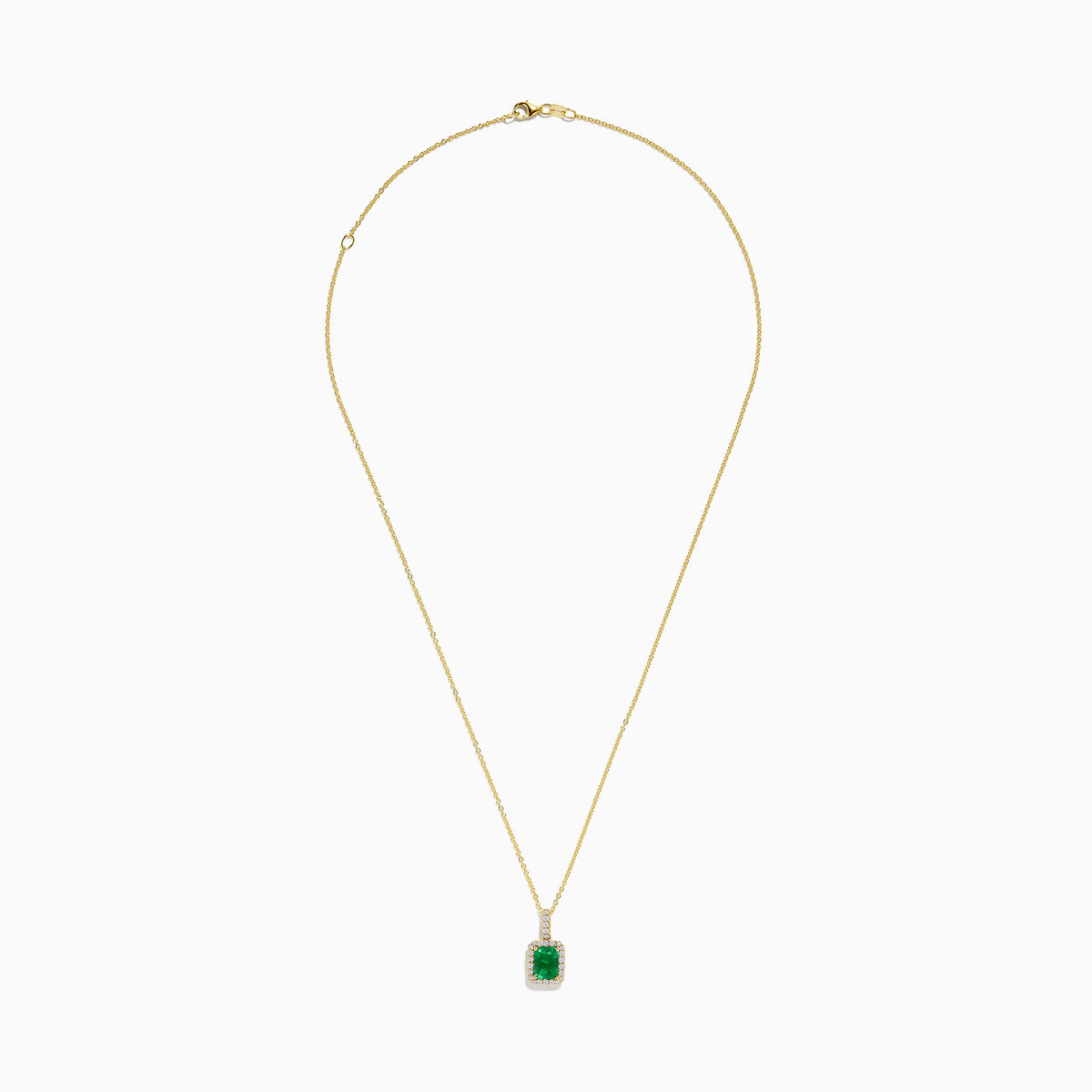 The 14K Yellow Gold Diamond and Emerald Pendant showcases a rectangular green emerald set in yellow gold, accented by small clear diamonds.