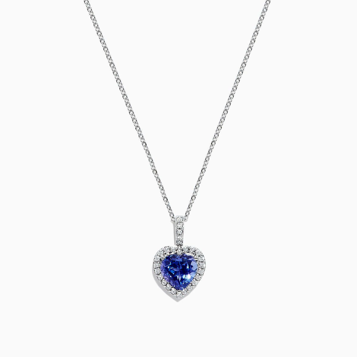 The Nahla Siri 14K White Gold Tanzanite and Diamond Heart Pendant, 2.32 TCW, features a heart-shaped blue tanzanite surrounded by sparkling diamonds, shown on a white background.