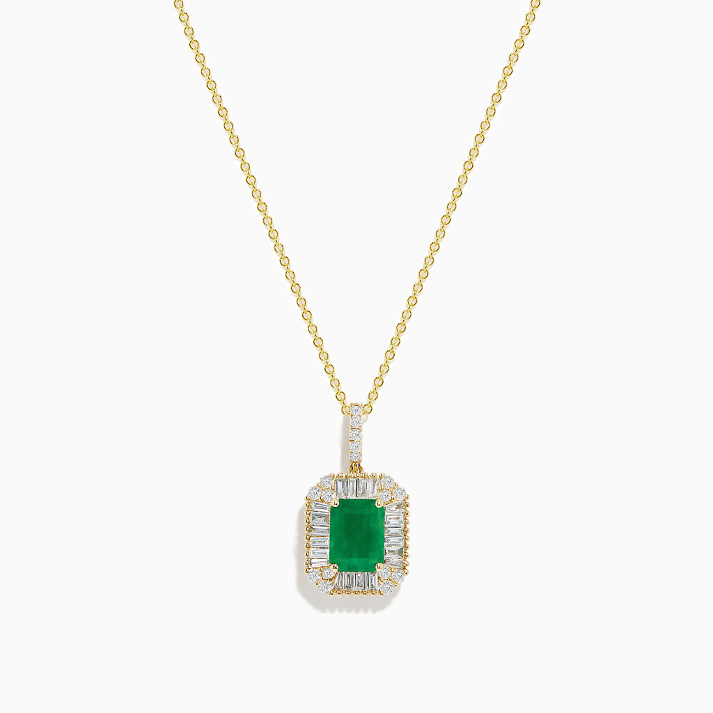 The 14K Yellow Gold Baguette Diamond Halo Emerald Pendant features a rectangular emerald framed by baguette and round diamonds, set in yellow gold with a decorative border, displayed against a white background.