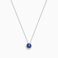 The 925 Sterling Silver Tanzanite Pendant features a delicate sterling silver chain with a tanzanite stone in a simple bezel setting, shown on a white background.