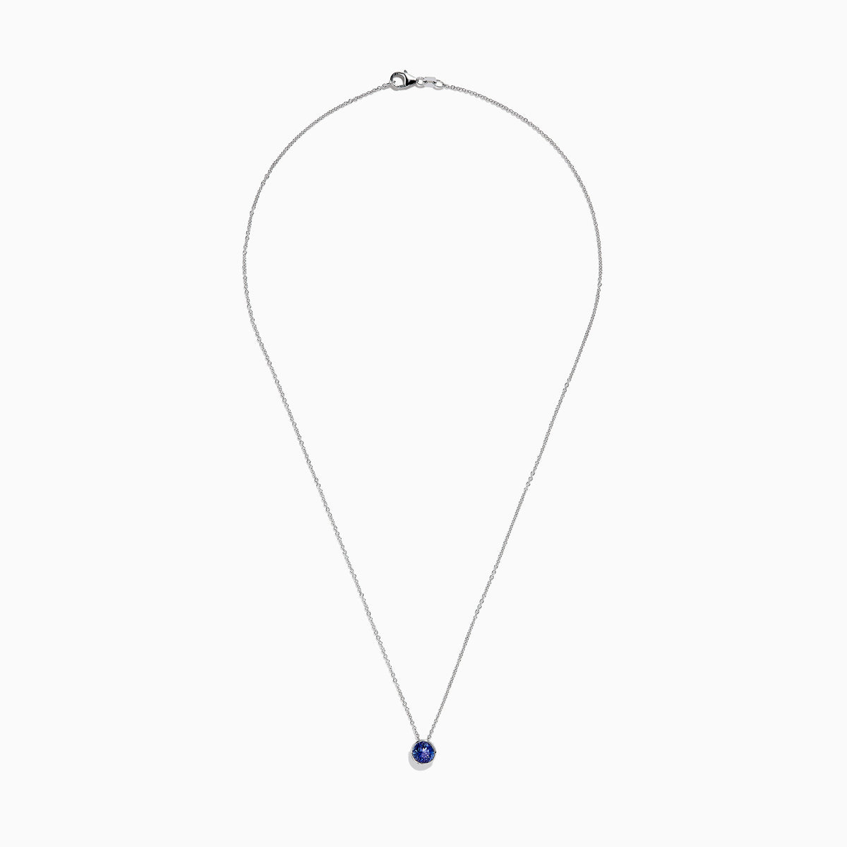 The 925 Sterling Silver Tanzanite Pendant features a delicate sterling silver chain with a tanzanite stone in a simple bezel setting, shown on a white background.