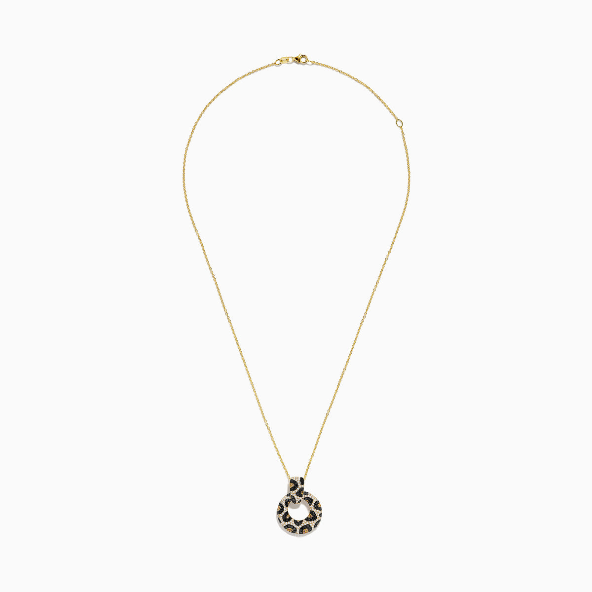 The Signature 14K Yellow Gold Diamond Spot Pendant features a circular design with black, gold, and white gemstones in a leopard print pattern. Its looped diamond detailing stands out beautifully against a plain white background.