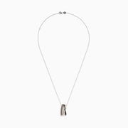 A 14K Trio-Color Gold Pendant with brown, black, and white diamonds (0.61 TCW) hangs from a silver chain, featuring an elegant intertwined design.