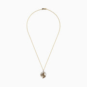 A Signature 14K yellow gold panther pendant, accented with multi-color diamonds (0.81 TCW), displays a sparkling green tsavorite eye and sits in a radiant circular frame.