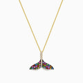 The Seaside 14K Gold Sapphire & Diamond Whales Tail Pendant features 0.82 TCW of stones, with sapphire accents and a row of clear diamonds at the center, all set on a gold chain against a white background.