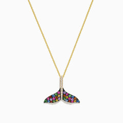 The Seaside 14K Gold Sapphire & Diamond Whales Tail Pendant features 0.82 TCW of stones, with sapphire accents and a row of clear diamonds at the center, all set on a gold chain against a white background.