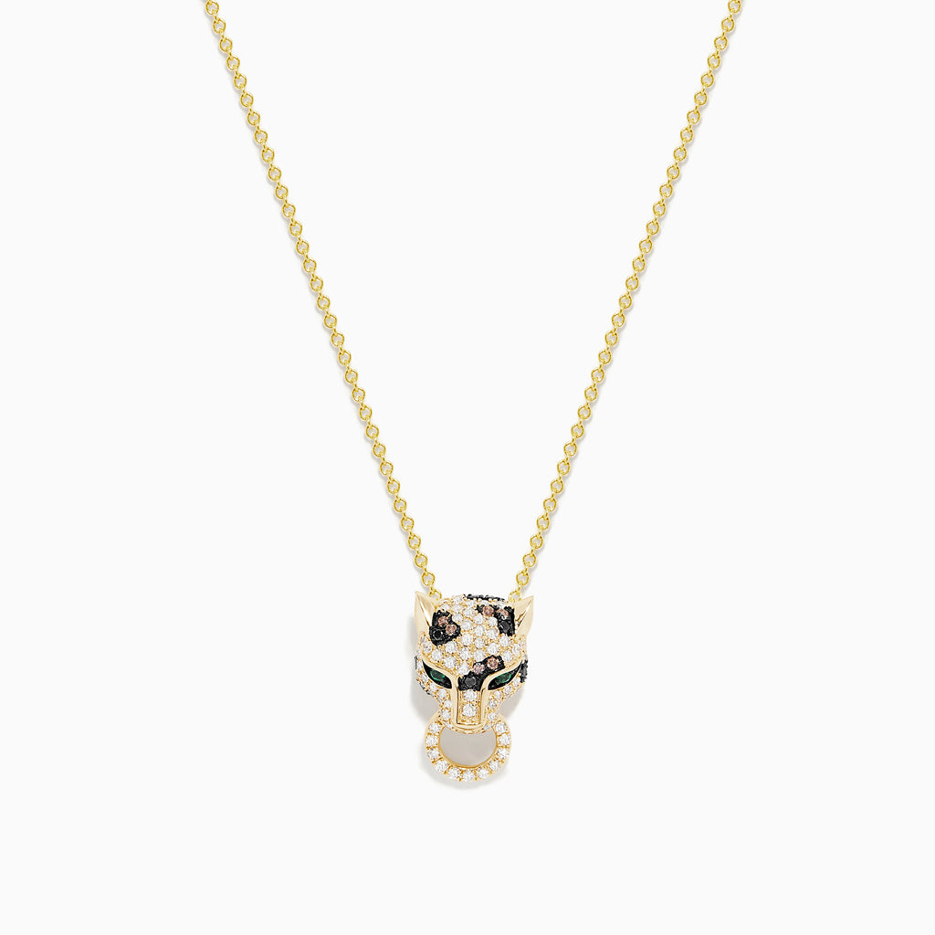 The Signature 14K Yellow Gold Diamond and Emerald Pendant features a panther’s head with diamond accents, emerald eyes, black detailing for spots, and a circular ring held in its mouth.