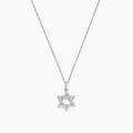 A dazzling Novelty 14K White Gold Diamond Star of David Pendant (0.14 TCW) is showcased against a simple white background, highlighting its sparkling elegance.