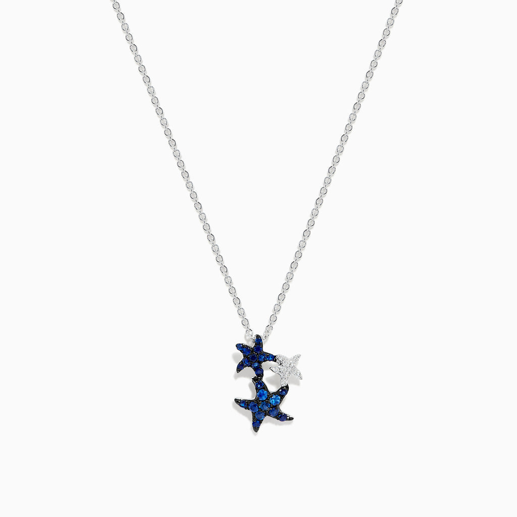 The Seaside 14K White Gold Sapphire and Diamond Starfish Pendant features three starfish—two with sparkling sapphires, one in plain white gold—hanging on a delicate chain against a white background.