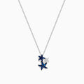 The Seaside 14K White Gold Sapphire and Diamond Starfish Pendant features three starfish—two with sparkling sapphires, one in plain white gold—hanging on a delicate chain against a white background.