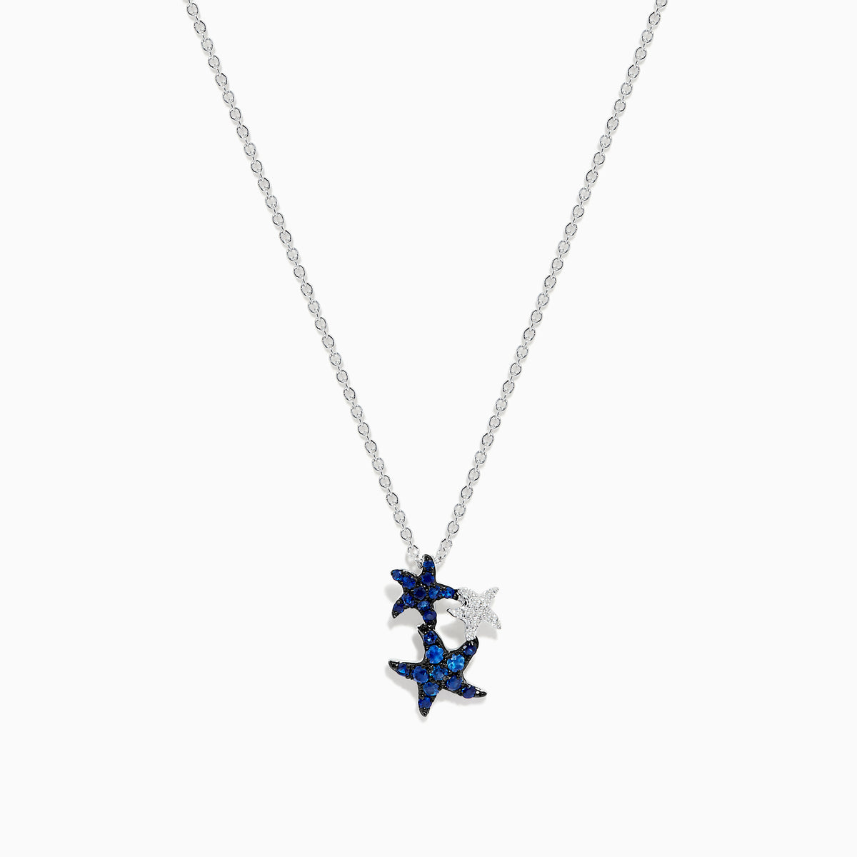 The Seaside 14K White Gold Sapphire and Diamond Starfish Pendant features three starfish—two with sparkling sapphires, one in plain white gold—hanging on a delicate chain against a white background.