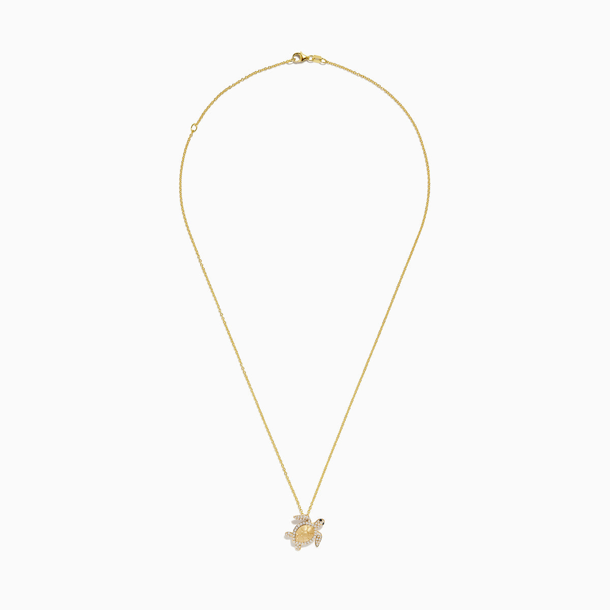 Seaside 14K yellow gold turtle pendant adorned with white and black diamonds, shown on a plain white background.