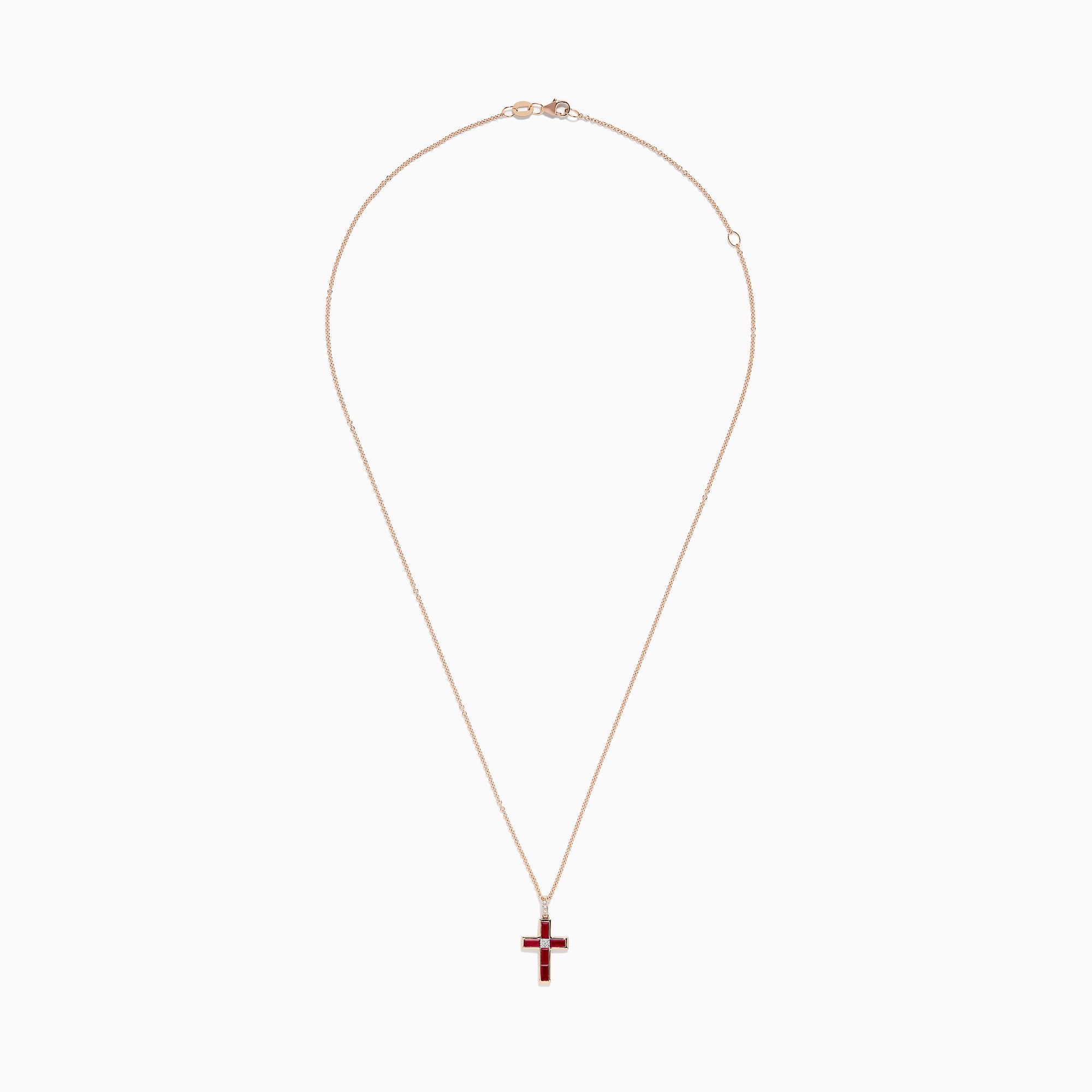 The Ruby Royale 14K Rose Gold Ruby and Diamond Cross Pendant, featuring a small clear center stone, is displayed on a rose gold chain against a white background.