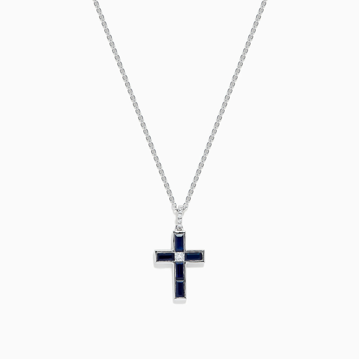 The Royale Bleu 14K White Gold Sapphire and Diamond Cross Pendant features a silver chain and striking dark blue sapphire-like rectangular stones, displayed on a plain white background.
