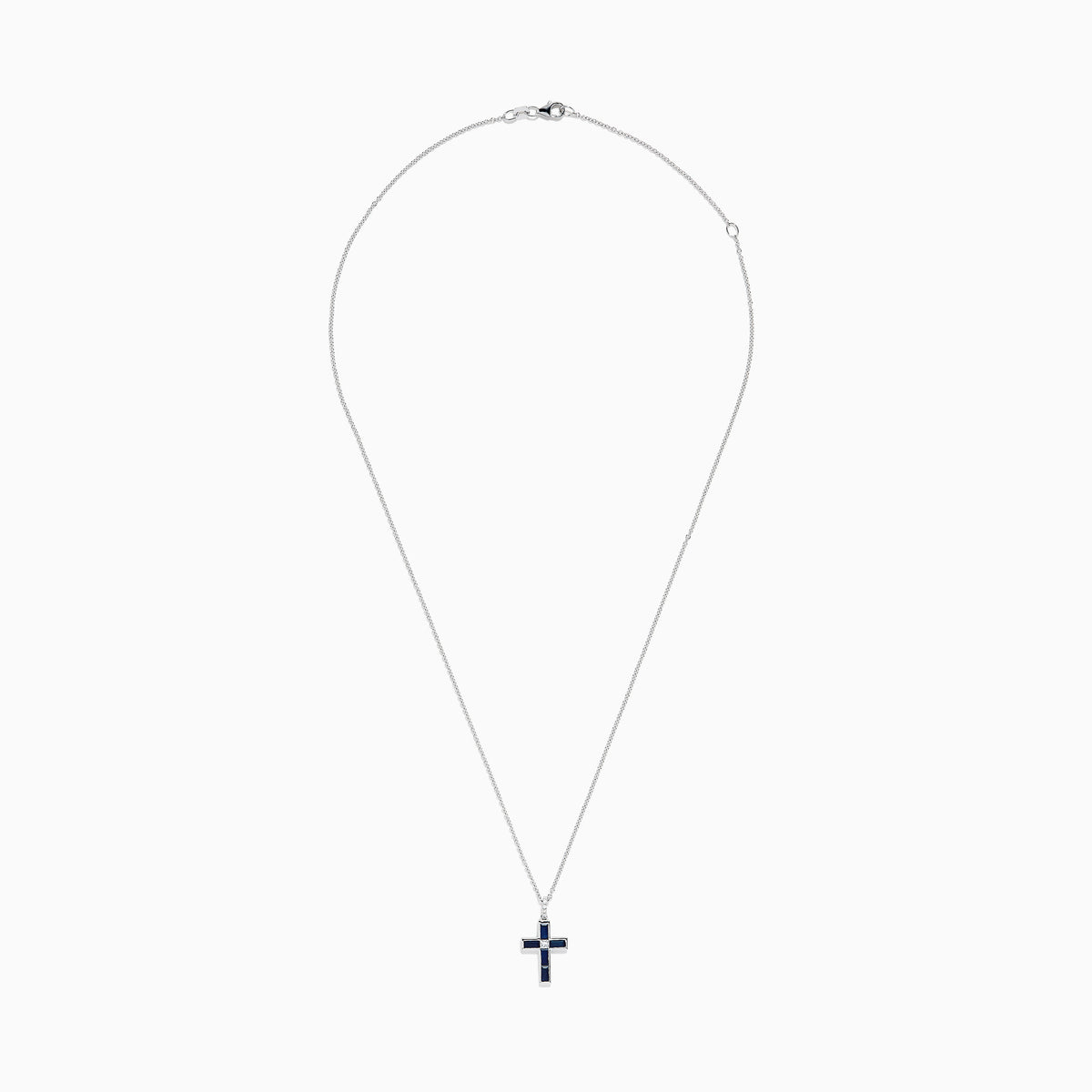 The Royale Bleu 14K White Gold Sapphire and Diamond Cross Pendant features a silver chain and striking dark blue sapphire-like rectangular stones, displayed on a plain white background.