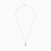 The Seaside 14K Yellow Gold Diamond and Sapphire Anchor Pendant features a yellow gold chain with an anchor-shaped pendant adorned with diamond accents and a sapphire at the top center.