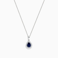 The Royale Bleu 14K White Gold Sapphire and Diamond Pendant features a teardrop sapphire encircled by shimmering diamonds, elegantly displayed on a white background.