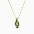 The 14K Yellow Gold Emerald and Diamond Pendant features a teardrop-shaped emerald design, highlighted by two curved rows of sparkling diamonds that outline its shape.