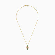 The 14K Yellow Gold Emerald and Diamond Pendant features a teardrop-shaped emerald design, highlighted by two curved rows of sparkling diamonds that outline its shape.