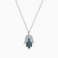 The Novelty 14K White Gold Blue and White Diamond Hamsa Pendant (0.35 TCW) is shown on a plain white background, featuring intricate diamond patterns on the pendant.