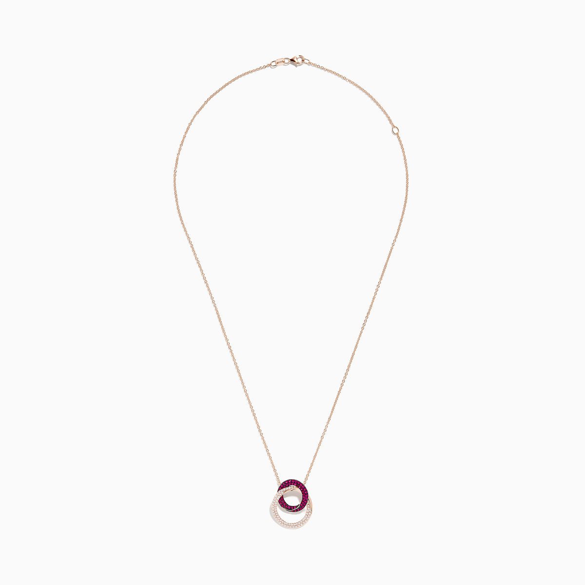 The Ruby Royale 14K Rose Gold Ruby and Diamond Intertwined Circles Pendant features two interlocking circles—one with rubies, one with diamonds—set against a white background, ideal for diamond jewelry lovers.