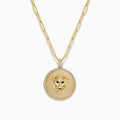 The Safari 14K Yellow Gold Diamond Lions Head Pendant features a detailed lion’s head in the center, bordered by sparkling diamonds and hangs from an elongated yellow gold chain.