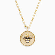 Nature 14K Yellow Gold Espresso and White Diamond Bee Coin Pendant: A yellow gold chain necklace with a round coin pendant featuring a white diamond bee, sparkling crystals, black accents, and a smooth ivory background.